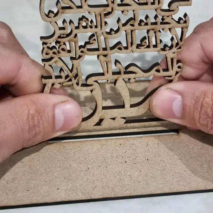 hold cross from the bottom at AMEN when inserting into base