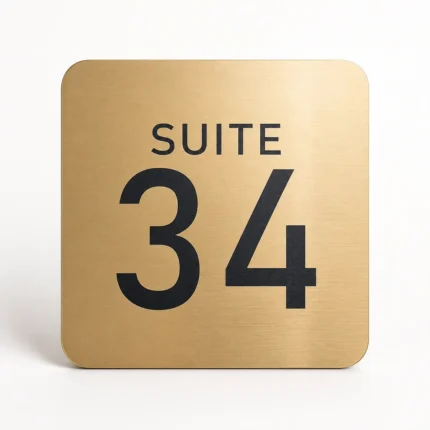 Custom door number sign in brushed gold acrylic with Suite 34 engraving